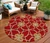 8' Orange And Gold Round Geometric Washable Indoor Outdoor Area Rug