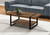 47" Brown And Black Wood Coffee Table With Shelf