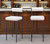Set of Two 30" Ivory and Black Shearling and Steel Low Back Bar Height Bar Chairs