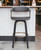 31" Gray And Black Faux Leather Swivel Bar Height Bar Chair