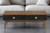 47" Brown And Black Coffee Table With Two Drawers