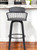 26" Gray And Black Faux Leather Swivel Low Back Counter Height Bar Chair