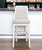 31" Gray And White Faux Leather And Solid Wood Bar Height Swivel Bar Chair