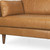 88" Tan Leather Sofa And Toss Pillows With Brown Legs