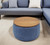 26" Blue and Brown Fabric And Wood Reversible Tray Top Round Storage Ottoman