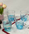 Set of Four Clear and Blue Acrylic Stemless Whiskey Glasses