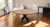 72" Natural And Black Rounded Solid Wood And Iron Pedestal Base Dining Table