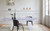 63" White Ceramic and Metal Self-Storing Leaf Pedestal Base Extendable Dining Table