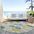 8' Teal Blue Yellow And Peach Round Geometric Washable Indoor Outdoor Area Rug