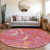 8' Blush Orange And Ivory Round Floral Washable Indoor Outdoor Area Rug