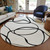 8' White And Black Round Abstract Washable Indoor Outdoor Area Rug
