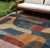 10' X 14' Navy Blue And Orange Abstract Washable Indoor Outdoor Area Rug