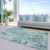 10' X 14' Teal Blue Green And Ivory Abstract Washable Indoor Outdoor Area Rug