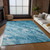 10' X 14' Sky Blue And Navy Blue Abstract Washable Indoor Outdoor Area Rug