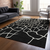 8' X 10' Black And Beige Abstract Washable Indoor Outdoor Area Rug