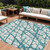 10' X 14' Teal Blue And Ivory Abstract Washable Indoor Outdoor Area Rug