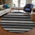 8' Black Ivory And Gray Round Striped Washable Indoor Outdoor Area Rug