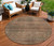 8' Orange Copper And Brown Round Striped Washable Indoor Outdoor Area Rug
