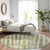8' Artichoke Green And Ivory Round Abstract Washable Indoor Outdoor Area Rug