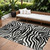 8' X 10' Black And Ivory Animal Print Washable Indoor Outdoor Area Rug