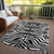 8' X 10' Black And Ivory Animal Print Washable Indoor Outdoor Area Rug