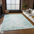 10' X 14' Teal Blue And Ivory Abstract Washable Indoor Outdoor Area Rug