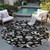 8' Black Beige And Ivory Round Floral Washable Indoor Outdoor Area Rug