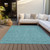 8' X 10' Teal Blue Black And Ivory Geometric Washable Indoor Outdoor Area Rug