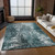 5' X 8' Teal Blue Gray And Charcoal Abstract Washable Indoor Outdoor Area Rug