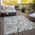 5' X 8' Brown Ivory And Tan Paisley Washable Indoor Outdoor Area Rug