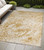 5' X 8' Cream and Gold Abstract Washable Non Skid Indoor Outdoor Area Rug