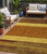 5' X 8' Terra Cotta Gold And Brown Abstract Washable Indoor Outdoor Area Rug