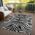 3' X 5' Black And Ivory Animal Print Washable Indoor Outdoor Area Rug