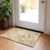 2' X 3' Cream and Gold Abstract Washable Non Skid Indoor Outdoor Area Rug