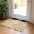 2' X 3' Cream and Gold Abstract Washable Non Skid Indoor Outdoor Area Rug