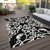 5' X 8' Black And Ivory Damask Washable Indoor Outdoor Area Rug