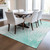 5' X 8' Aquamarine And Ivory Abstract Washable Indoor Outdoor Area Rug