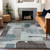 5' X 8' Teal Blue Gray And Charcoal Abstract Washable Indoor Outdoor Area Rug