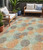 5' X 8' Beige Aqua And Orange Polka Dot Washable Indoor Outdoor Area Rug