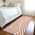 2' X 8' Orange and White Geometric Washable Non Skid Indoor Outdoor Runner Rug