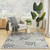 5' X 7' Gray Black And Ivory Palm Leaf Indoor Outdoor Area Rug