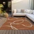 3' X 5' Copper And Ivory Abstract Washable Indoor Outdoor Area Rug