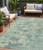 5' X 8' Teal Blue Linen And Pale Aqua Abstract Washable Indoor Outdoor Area Rug