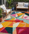 5' X 8' Ivory Orange And Burgundy Geometric Washable Indoor Outdoor Area Rug