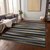5' X 8' Black Brown And Ivory Striped Washable Indoor Outdoor Area Rug