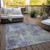 5' X 8' Purple and Green Abstract Washable Non Skid Indoor Outdoor Area Rug