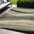 5' X 8' Taupe Gray And Black Abstract Washable Indoor Outdoor Area Rug