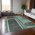 5' X 8' Black and Green Abstract Washable Indoor Outdoor Area Rug
