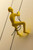 Homeroots Home Decor Resin Yellow Climbing Man, 6 x 3 x 3 inches