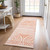 2' X 8' Orange and Ivory Abstract Washable Non Skid Indoor Outdoor Area Rug